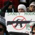 People hold signs memorializing Sandy Hook Elementary School as they participate in the March on Washington for Gun Control on the National Mall in Washington