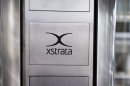 FILE - In this Feb. 7, 2012 file picture the Xstrata logo, is pictured at the headquarters of Xstrata in Zug, Switzerland. Commodities trader Glencore International said Wednesday, June 27, 2012 that it is considering changes in incentives for senior employees of Xstrata, amid growing shareholder concerns over its proposed takeover of the mining company. The possible revision of the offer comes barely two weeks ahead of a shareholders vote on the deal. Glencore's announcement followed a demand by a Qatari investment fund for better terms for its 10 percent stake in Xstrata. It wants 3.25 new Glencore shares for each Xstrata share, significantly more than the 2.8 shares currently on offer. (AP Photo/Keystone/Sigi Tischler,File)