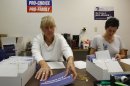 NARAL Pro-Choice New Hampshire volunteer Gail Laker-Phelps and NARAL Pro-Choice New Hampshire Campaign Director Melissa Bernardin put address labels mailers which read, "Do you want politicians in your bedroom?" in Concord