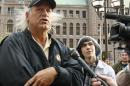 FILE - In this Oct. 7, 2011 file photo, former Minnesota Gov. Jesse Ventura, left, talks to the media in Minneapolis. Ventura sued Chris Kyle, the author of the best-selling book 