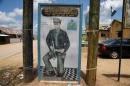 A painting depicting Isaac Adaka Boro, a former Niger Delta militant in the 1960s, is seen along a road in the village of Kiama near Yenagoa