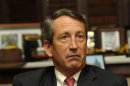 In this Tuesday, Dec. 14, 2010 photo, S.C. Gov. Mark Sanford talks with Associated Press reporters in his office in Columbia, S.C. about his time in office and his future. (AP Photo/Virginia Postic)