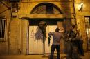Israeli security forces search the area where, according to Israeli police spokesperson, at least 10 Israelis were stabbed, in the popular Jaffa port area of Tel Aviv, Israel