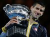 Serbia's Novak Djokovic holds his trophy after defeating Britain's Andy Murray in the men's final at the Australian Open tennis championship in Melbourne, Australia, Sunday, Jan. 27, 2013. (AP Photo/Aaron Favila)