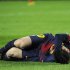 Barcelona's Lionel Messi reacts after picking up an injury while trying to score a goal against Benfica's goalkeeper Artur during their Champions League Group G soccer match at the Nou Camp stadium in Barcelona
