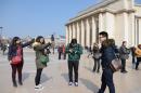 Chinese tourists take pictures at Trocadero square in Paris, on March 27, 2013
