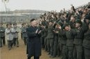 Still image taken from video shows North Korean leader Kim Jong-un applauding as he is welcomed by members of the military at an undisclosed location
