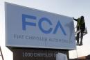 A new Fiat Chrysler Automobiles sign is unveiled at Chrysler Group World Headquarters in Auburn Hills, Michigan