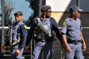 South African police patrol near Johannesburg Airport on May 12, 2010