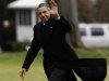 President Barack Obama waves as he steps off the Marine One helicopter and walks on the South Lawn at the White House in Washington, Thursday, Dec. 27, 2012, as he returned early from his Hawaii vacation for meetings on the fiscal cliff. (AP Photo/Charles Dharapak)