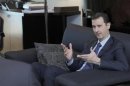 Syria's President Bashar al-Assad speaks during an interview with a Russian newspaper in Damascus