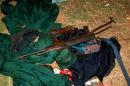 A weapon and clothes belonging to members of former Mozambican rebel movement Renamo lying on the ground in Gorongosa on October 17, 2013