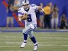 Cowboys quarterback Tony Romo runs with the ball against the New York Giants during their NFL football game in East Rutherford