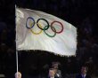 London mayor Johnson holds the Olympic flag next to IOC President Rogge and Rio de Janeiro mayor Paes during the closing ceremony of the London 2012 Olympic Games at the Olympic Stadium