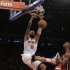 New York Knicks center Tyson Chandler (6) dunks in front of Miami Heat center Chris Bosh (1) during the first half of their NBA basketball game at Madison Square Garden in New York, Sunday, March 3, 2013. (AP Photo/Kathy Willens)