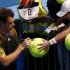 Andy Murray of Britain signs autographs for fans after defeating Gilles Simon of France in their men's singles match at the Australian Open tennis tournament in Melbourne