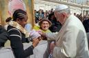In this March 26, 2014, photo provided by Catholic Coalition of Immigrant Rights, Pope Francis touches 10-year-old Jersey Vargas, who traveled to the Vatican from Los Angeles to plead with him to help spare her father from deportation, during a public audience at St. Peter's Square in Vatican City. Her father, Mario Vargas, in the United States illegally, had been in federal custody and faced possible deportation. After speaking with Francis, Mario Vargas was released on bond from immigration detention, Immigration and Customs Enforcement said Friday, March 28, 2014. Jersey Vargas was part of a California delegation that sought to encourage the Vatican to prod President Obama on immigration reform. (AP Photo/Catholic Coalition of Immigrant Rights)