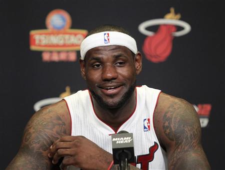 LeBron James responds to a question at a news conference during media day at the Miami Heat's home arena in Miami, Florida September 28, 2012. REUTERS/Andrew Innerarity
