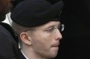 U.S. soldier Manning is escorted into court to receive his sentence at Fort Meade in Maryland