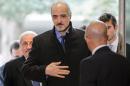 Syrian Ambassador to the United Nations (UN) and head of the government delegation Bashar al-Jaafari (C) arrives for Syrian peace talks in Geneva on February 2, 2016