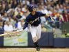 Milwaukee Brewers Norichka Aoki watches his deep fly ball off of Atlanta Braves pitcher Mike Minor during the fifth inning of a baseball game Monday, Sept. 10, 2012, in Milwaukee. (AP Photo/Tom Lynn)