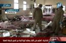Saudi security forces are seen inspecting the site of an explosion at a mosque in the special forces headquarters in Abha, in an image taken from Saudi's Al-Ekhbaria TV on August 6, 2015