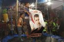 Children of the supporters of deposed Egyptian President Mohamed Mursi play in a makeshift funfair outside of the sit-in area of Rab'a al- Adawiya Square in Cairo