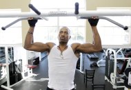 In this photo taken Thursday, April 19, 2012, Kelman Edwards Jr., working out at an apartment complex gym near the campus of Middle Tennessee State University in Murfreesboro,Tenn. The college class of 2012 is in for a rude welcome to the world of work. A weak labor market already has left half of young college grads either jobless or underemployed in positions that don't fully use their skills and knowledge. (AP Photo/Mark Humphrey)