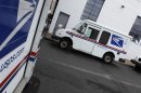United States Postal Service trucks are seen in Manhasset, New York