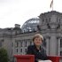German Chancellor Merkel poses for photographers after the television recording of the "ARD Sommerinterview" in Berlin
