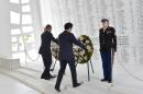 US President Barack Obama (L) and Japanese Prime Minister Shinzo Abe place wreaths at the USS Arizona Memorial December 27, 2016 at Pearl Harbor in Honolulu, Hawaii