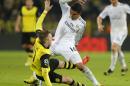 Dortmund's Marco Reus, left, and Real's Casemiro challenge for the ball during the Champions League quarterfinal second leg soccer match between Borussia Dortmund and Real Madrid in the Signal Iduna stadium in Dortmund, Germany, Tuesday, April 8, 2014. (AP Photo/Frank Augstein)