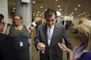 Cruz talks with a reporter after the weekly Republican caucus luncheon at the U.S. Capitol in Washington