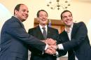 Handout picture released by the Cypriot government's Press and Information Office shows Greek PM Tsipras, Cypriot President Anastasiades, Egyptian President Sisi during a joint press conference at the Presidential Palace in Nicosia on April 29, 2015