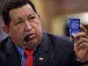 FILE - In this Oct 9, 2012 file photo, Venezuela’s President Hugo Chavez holds a miniature copy of his country's constitution during a news conference in Caracas, Venezuela.  The ailing president's health crisis has raised contentious questions ahead of the swearing-in set for Jan. 10, including whether the inauguration could legally be postponed. Officials have raised the possibility that Chavez might not be well enough to take the oath of office, without saying what will happen if he can't. The constitution says that if a president or president-elect dies or is declared unable to continue in office, presidential powers should be held temporarily by the president of the National Assembly and that a new presidential vote should be held within 30 days. (AP Photo/Rodrigo Abd, File)