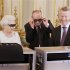 Britain's Queen Elizabeth watches a preview of her Christmas message with a pair of 3D glasses in London