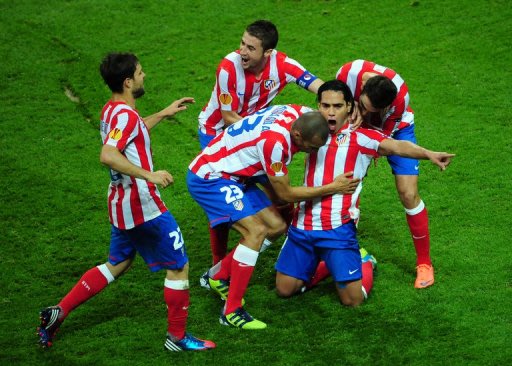 Atletico Madrid's Radamel Falcao (2nd R) celebrates with his teammates after scoring