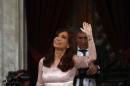 Argentina's President Cristina Fernandez de Kirchner waves after arriving for the opening session of the 133rd legislative term of Congress in Buenos Aires