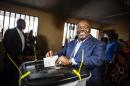 Gabonese President Ali Bongo casts his vote at a polling station in Libreville during the presidential election on August 27, 2016