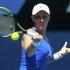Svetlana Kuznetsova of Russia hits a return to Caroline Wozniacki of Denmark during their women's singles match at the Australian Open tennis tournament in Melbourne