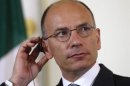 Italy's Prime Minister Letta listens during a news conference in Vienna