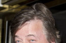 FILE - Actor Stephen Fry at a central London cinema, London, in this Thursday, Dec. 8, 2011 file photo. The entertainment industry is using its star power and money power to raise a storm of protest over the anti-gay legislation in Russia that is battering the image of the Winter Olympics in Sochi. Actor-playright Harvey Fierstein, British writer-actor Stephen Fry and `Star Trek actor George Takei are among those who have publicly blasted the new law, fueling an uproar that is overshadowing the games with the opening ceremony less than six months away.(AP Photo/Joel Ryan, File)
