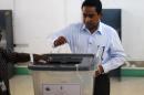 Maldivian presidential candidate Abdulla Yameen casts his vote at a polling station in Male on November 16, 2013