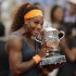Serena Williams of the U.S. holds the trophy after defeating Russia's Maria Sharapova in two sets 6-4, 6-4, in the women's final of the French Open tennis tournament, at Roland Garros stadium in Paris, Saturday June 8, 2013. (AP Photo/Christophe Ena)