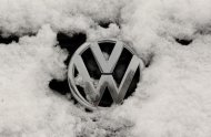 A snow-covered Volkswagen logo is pictured at a Volkswagen car dealer in the western city of Hamm January 14, 2013. REUTERS/Ina Fassbender