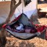 A Syrian baby cries as he lays on a swing attached to a tree at a displaced camp, in the Syrian village of Atma, near the Turkish border with Syria, Monday, Nov. 5, 2012. (AP Photo/ Khalil Hamra)