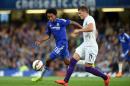 Chelsea's Juan Cuadrado, left, battles for the ball with Fiorentina's Ante Rebic, during the International Champions Cup soccer match at Stamford Bridge, London, Wednesday Aug. 5, 2015. (Adam Davy/PA via AP) UNITED KINGDOM OUT