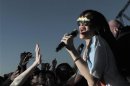 Rihanna goes into the crowd during a performance at the Hackney Weekend festival at Hackney Marshes in east London