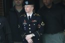 U.S. Army Pfc. Manning is escorted out of courthouse during his court martial at Fort Meade in Maryland