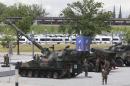 Polish Army soldiers prepare a display of Polish-made combat vehicles in front of the National Stadium, the venue of the upcoming NATO summit, in Warsaw, Poland, Wednesday, July 6, 2016. The Polish capital will host a two-day NATO summit starting Friday, the first time ever that it hosts a top-level meeting of the Western military alliance which it joined in 1999. (AP Photo/Czarek Sokolowski)